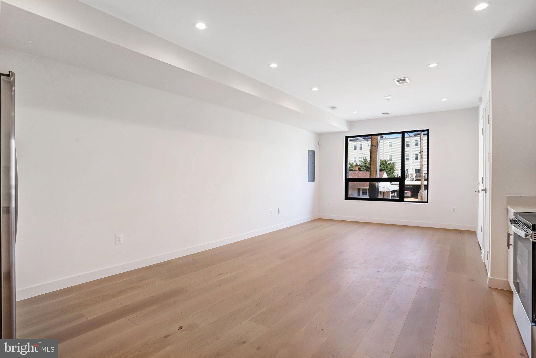 5221 F Street Southeast Washington, DC 20019 - Photo 17 of 63 wooden floor in an empty room with a window