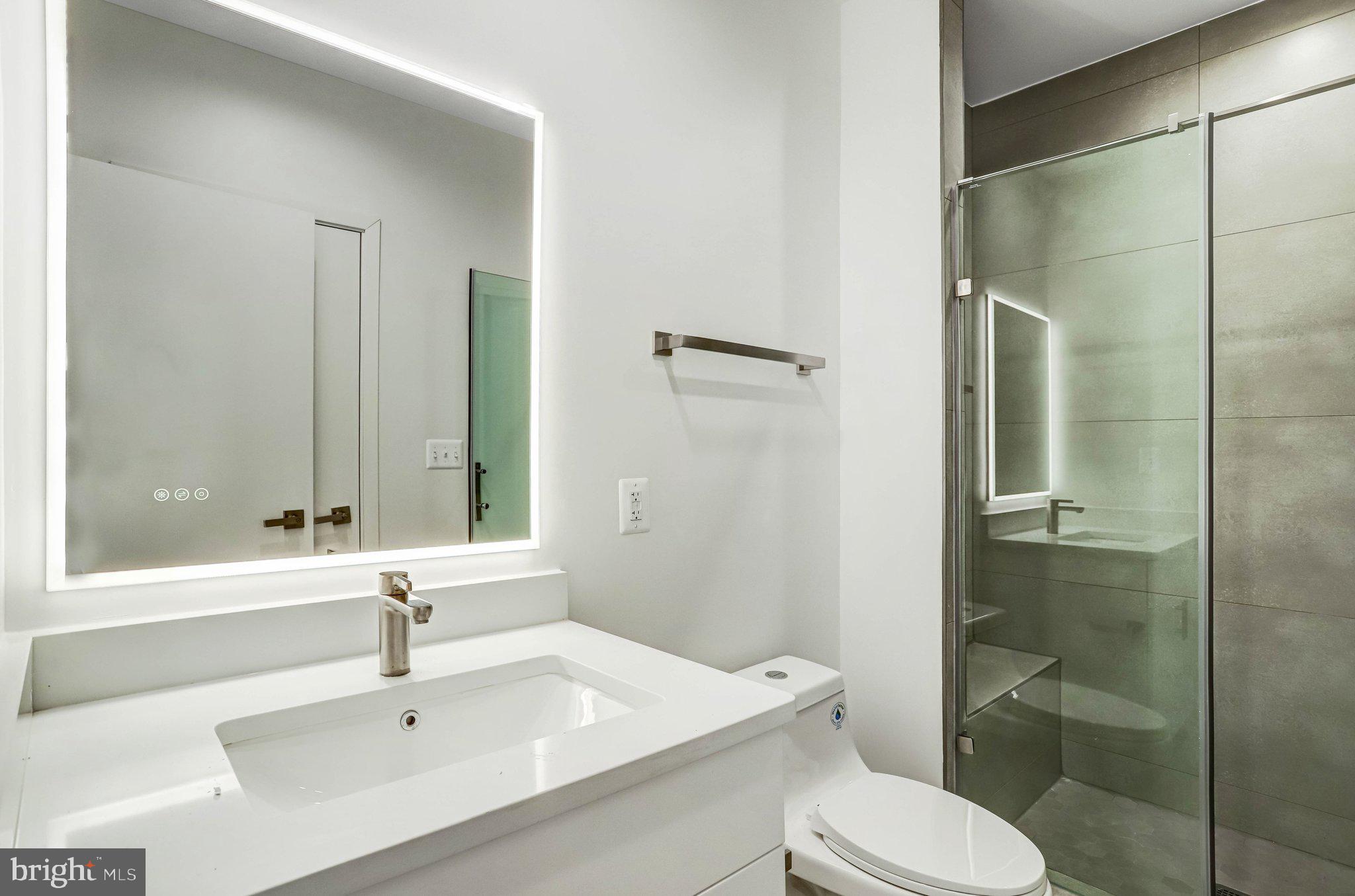 5221 F Street Southeast Washington, DC 20019 - Photo 19 of 63 a bathroom with a sink toilet and shower