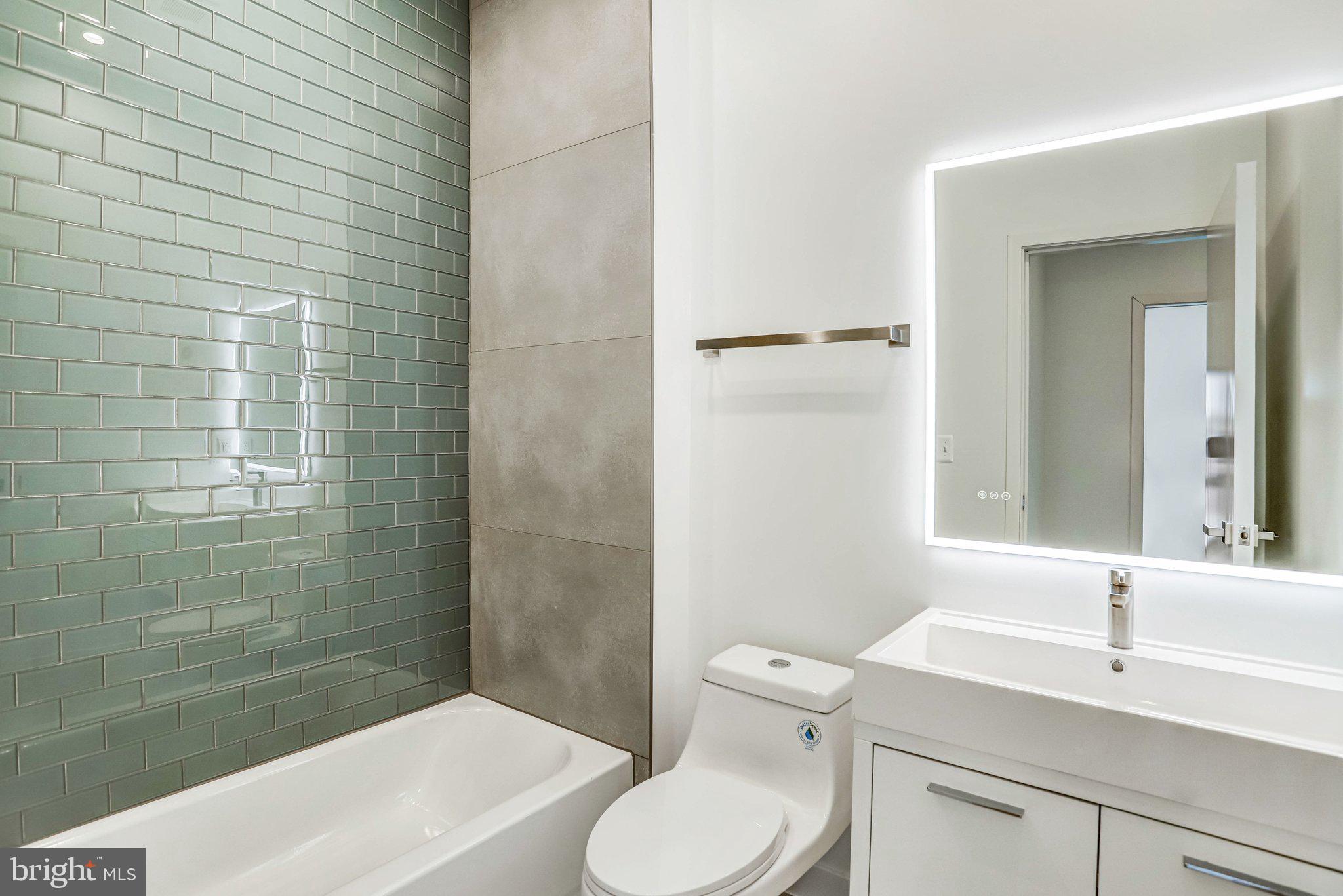 5221 F Street Southeast Washington, DC 20019 - Photo 45 of 63 a bathroom with a sink a toilet and shower
