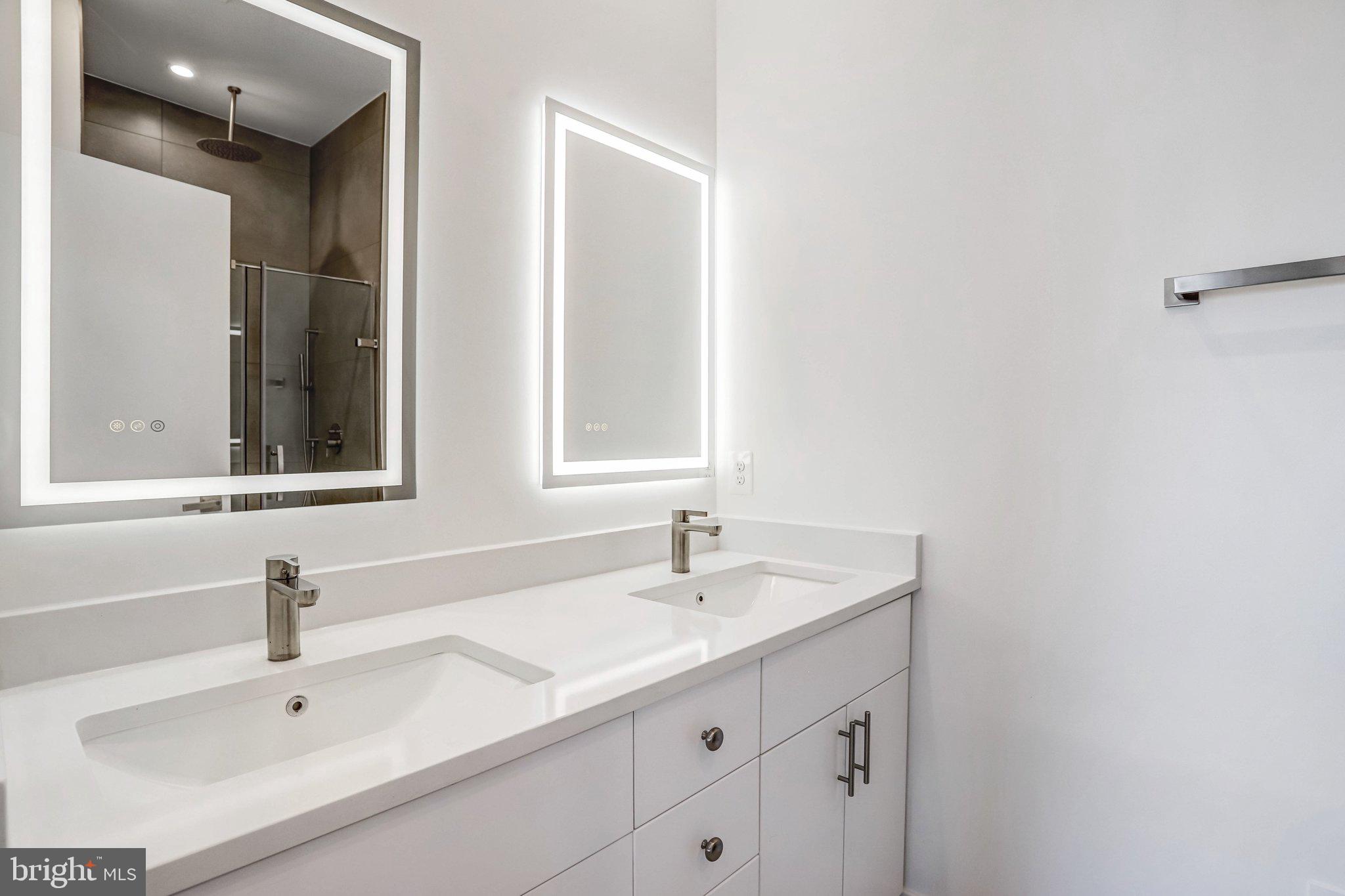5221 F Street Southeast Washington, DC 20019 - Photo 55 of 63 a bathroom with a sink and a mirror