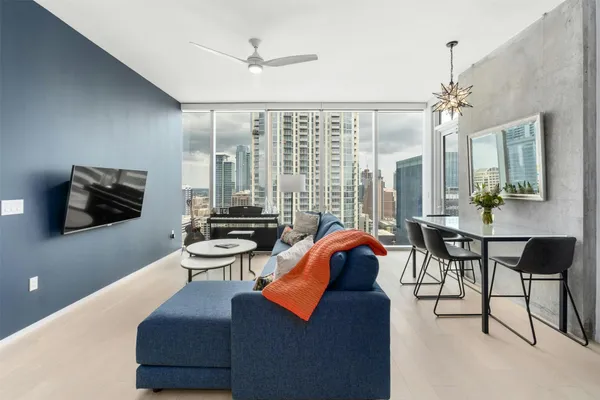a living room with furniture and a flat screen tv