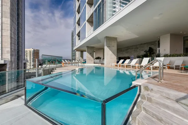swimming pool view with outdoor seating