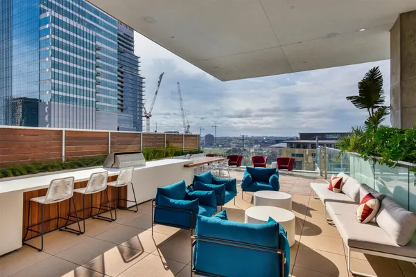 a view of balcony with seating space and potted plants