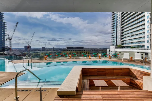 a view of swimming pool with outdoor seating