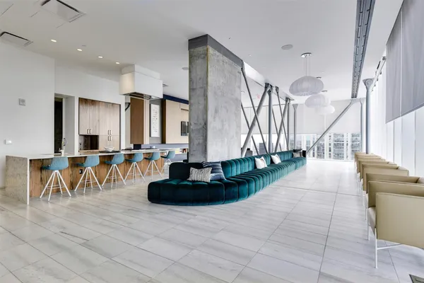 a lobby with furniture and stairs