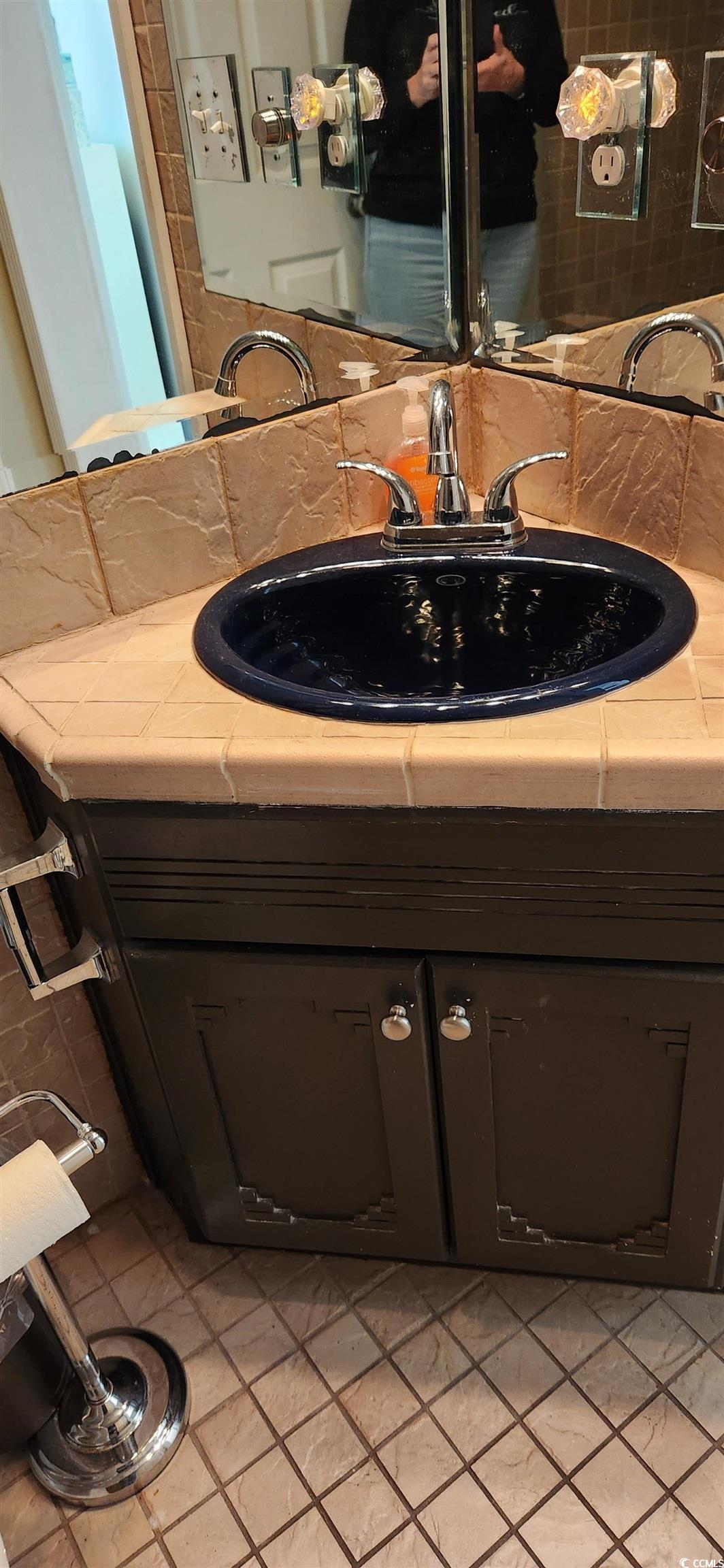 1919 Spring Street, Unit B11 North Myrtle Beach, SC 29582 - Photo 19 of 32 Bathroom with vanity and tile patterned flooring