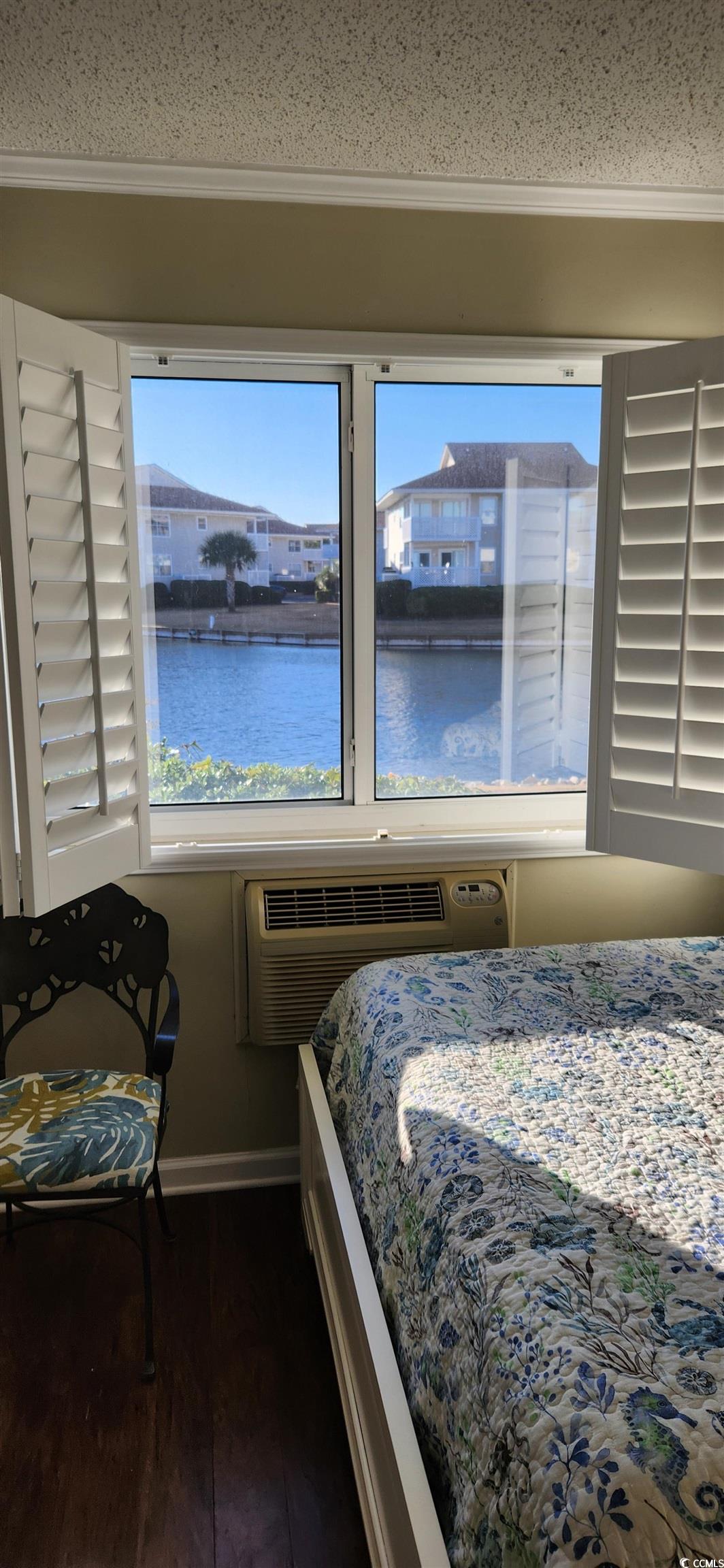 1919 Spring Street, Unit B11 North Myrtle Beach, SC 29582 - Photo 21 of 32 Bedroom with a water view, dark hardwood / wood-st