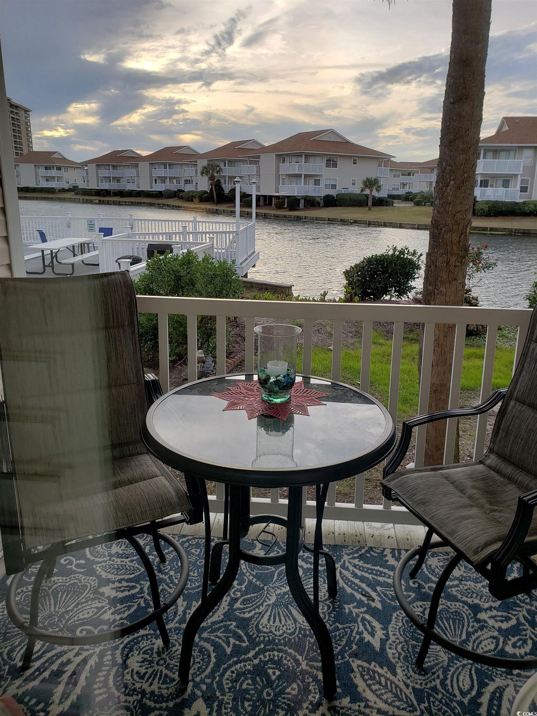 1919 Spring Street, Unit B11 North Myrtle Beach, SC 29582 - Photo 26 of 32 Balcony at dusk, enjoy a private happy hour!