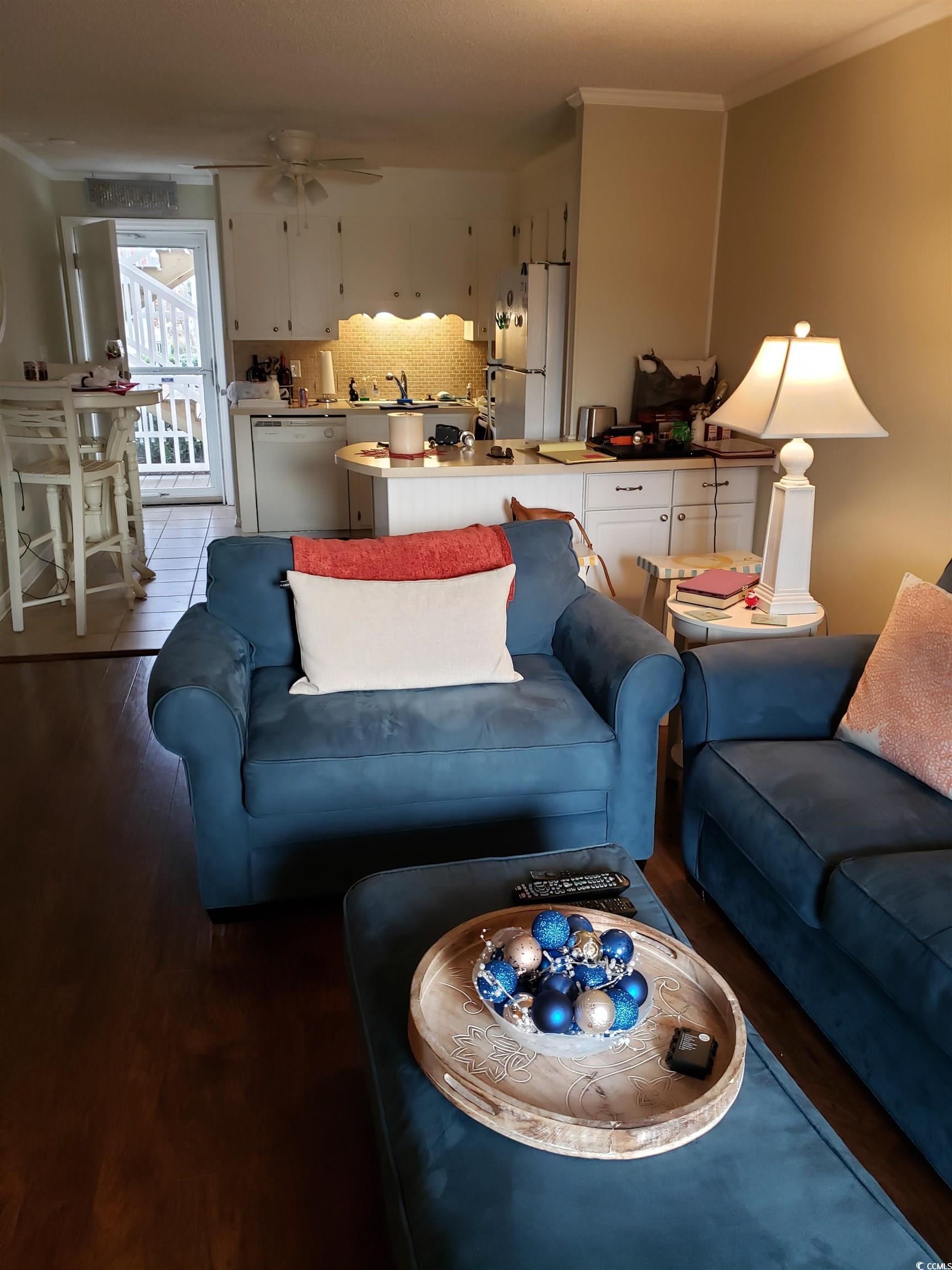 1919 Spring Street, Unit B11 North Myrtle Beach, SC 29582 - Photo 4 of 32 Living room features a ceiling fan, comfortable se