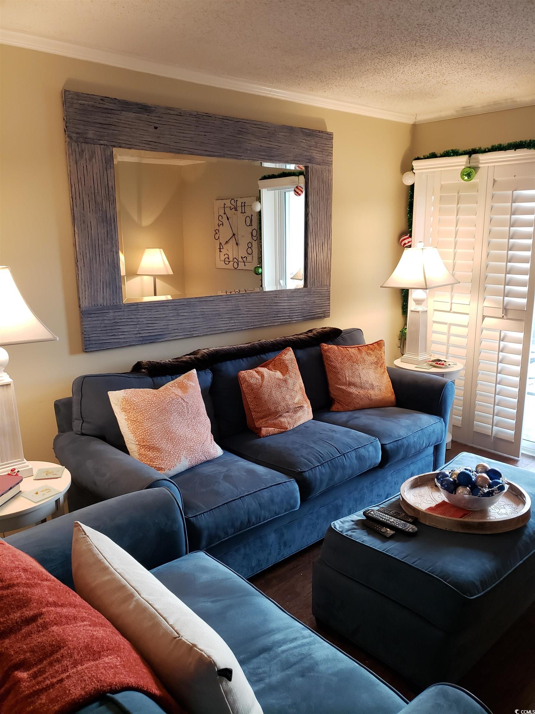 1919 Spring Street, Unit B11 North Myrtle Beach, SC 29582 - Photo 5 of 32 Living room with ornamental molding and a textured