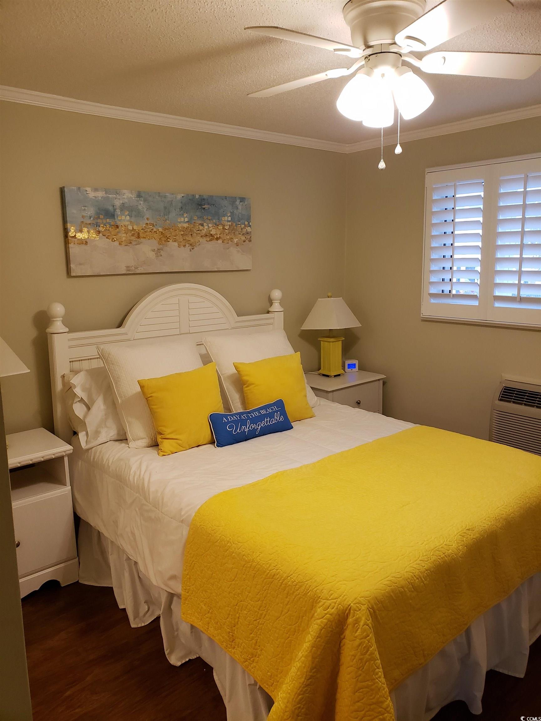 1919 Spring Street, Unit B11 North Myrtle Beach, SC 29582 - Photo 9 of 32 Bedroom featuring crown molding, ceiling fan, dark