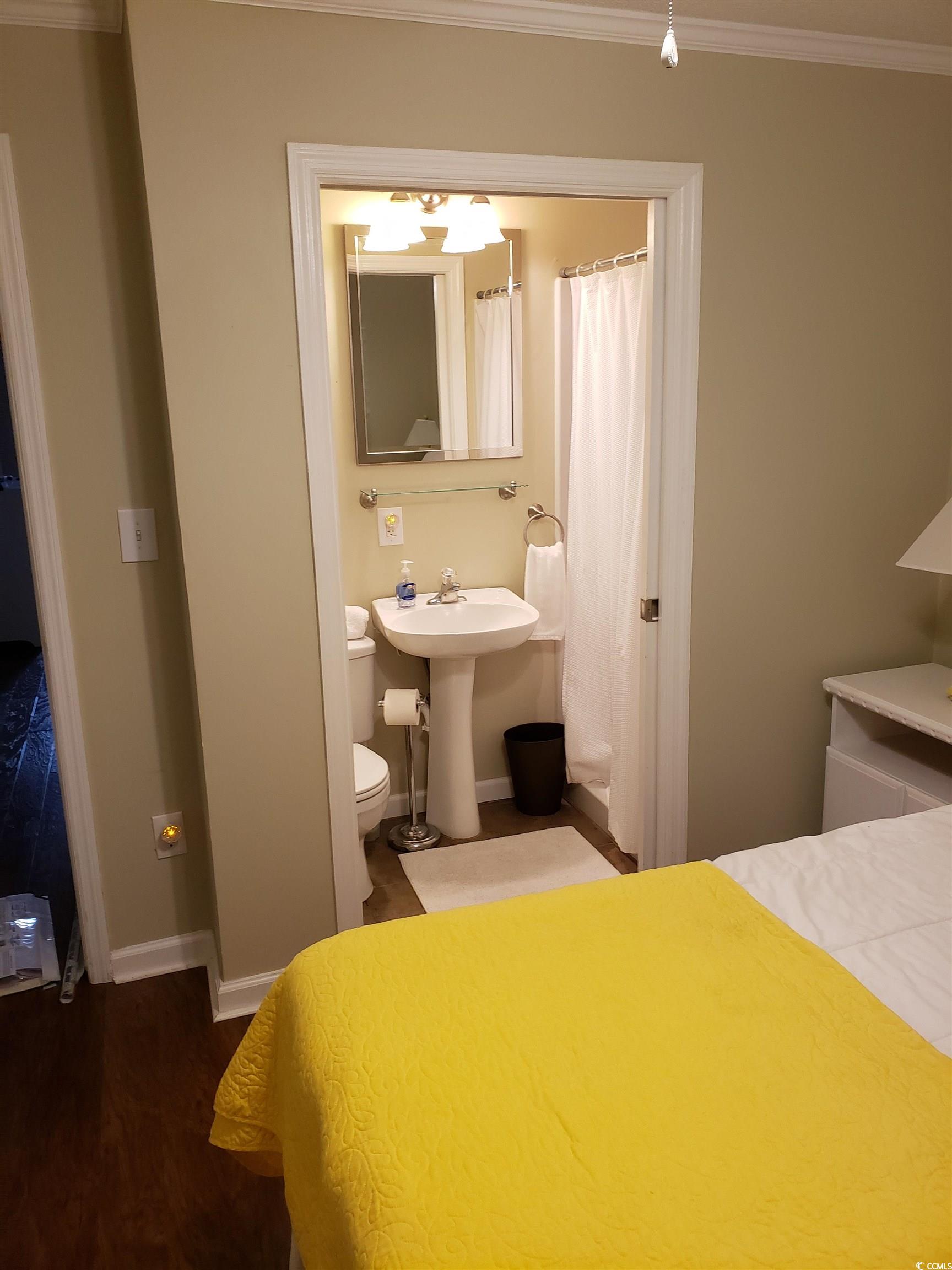 1919 Spring Street, Unit B11 North Myrtle Beach, SC 29582 - Photo 10 of 32 Bedroom featuring sink, hardwood / wood-style floo