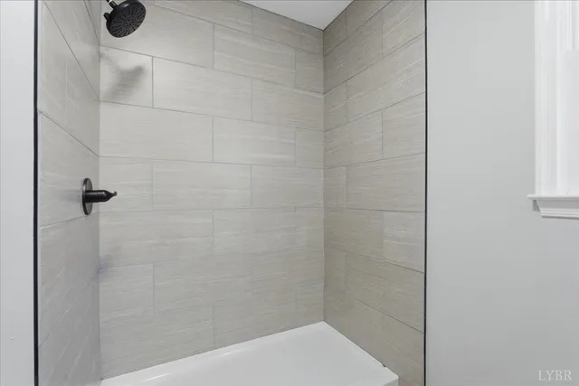 a bed room with a bed and a large window