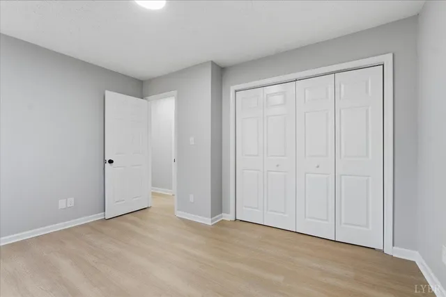 a kitchen with stainless steel appliances a stove microwave and cabinets
