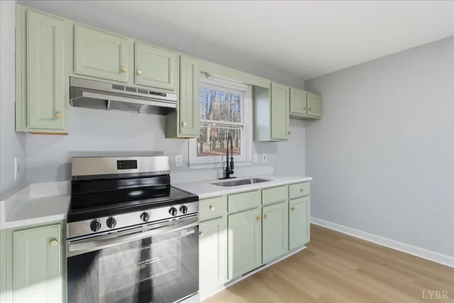 a kitchen with a stove and a sink