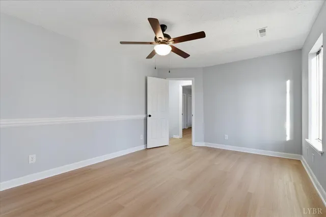 a view of a room with wooden walls