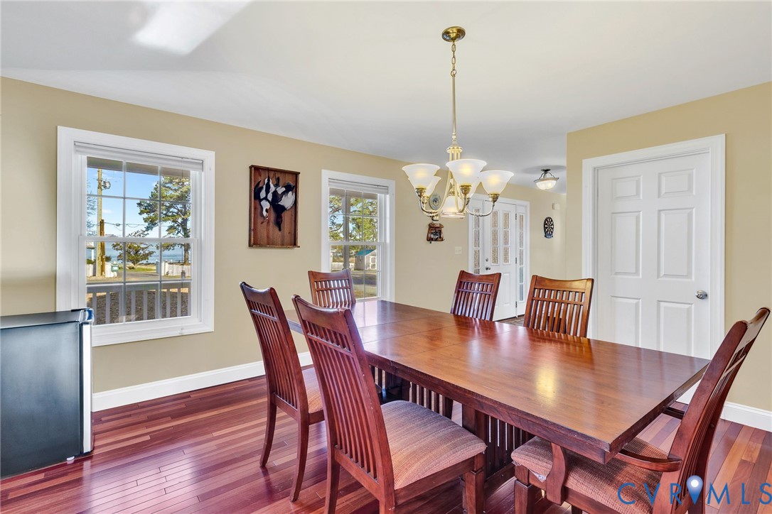 275 Granny's Bar Road Hague, VA 22469 - Photo 23 of 53 a view of a dining room with furniture window and wooden floor