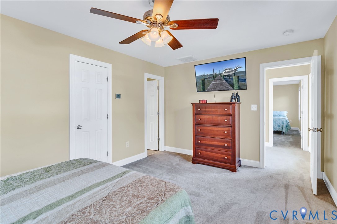 275 Granny's Bar Road Hague, VA 22469 - Photo 33 of 53 a view of room with closet and a ceiling fan