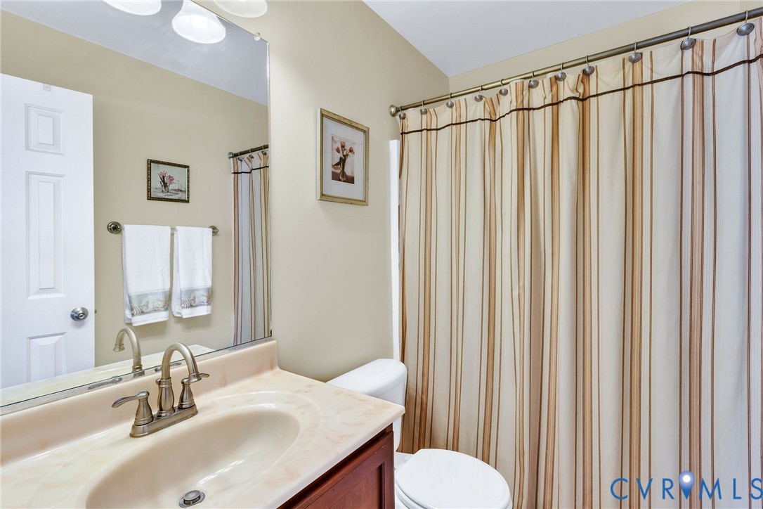 275 Granny's Bar Road Hague, VA 22469 - Photo 35 of 53 a bathroom with a sink and a mirror