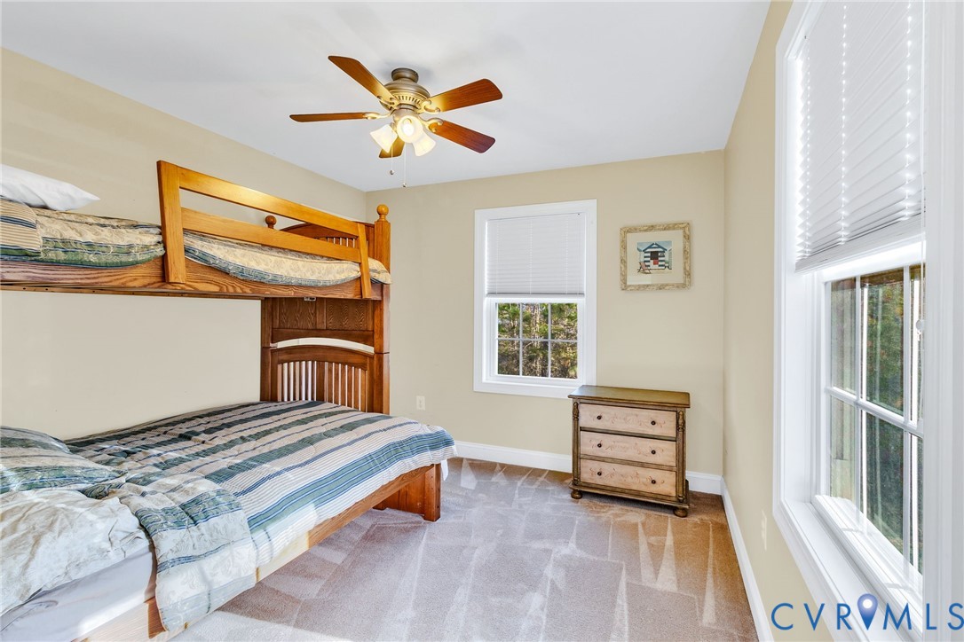 275 Granny's Bar Road Hague, VA 22469 - Photo 41 of 53 a bedroom with a bed and a window