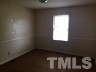 4541 Hargrove Road, Unit AD Raleigh, NC 27604 - Photo 11 of 22 an empty room with a window