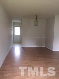 4541 Hargrove Road, Unit AD Raleigh, NC 27604 - Photo 5 of 22 a view of room with window and hardwood floor