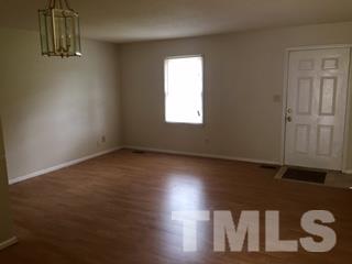 4541 Hargrove Road, Unit AD Raleigh, NC 27604 - Photo 6 of 22 an empty room with a window
