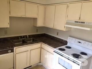 4541 Hargrove Road, Unit AD Raleigh, NC 27604 - Photo 9 of 22 a kitchen with a sink and cabinets