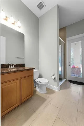 a spacious bathroom with a sink a bathtub a mirror a vanity and a window