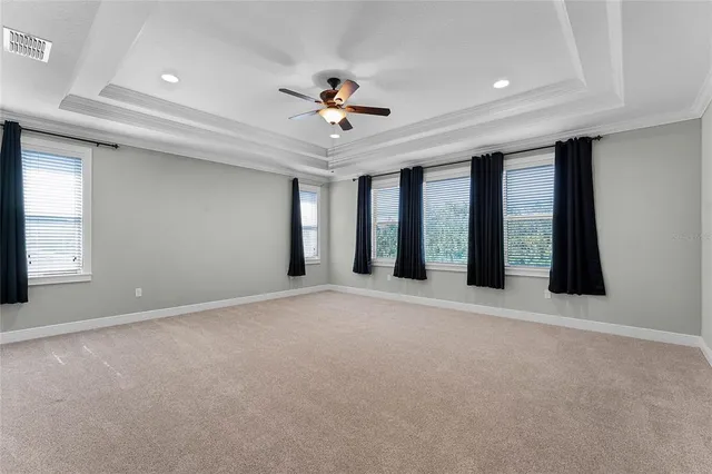 a bathroom with a granite countertop sink a mirror and a bathtub