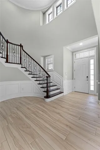 a view of an entryway with wooden floor