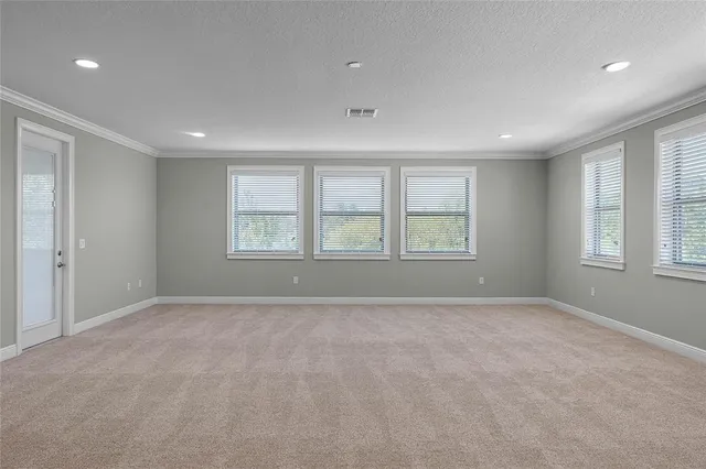 a bathroom with a granite countertop sink a toilet a mirror and a shower