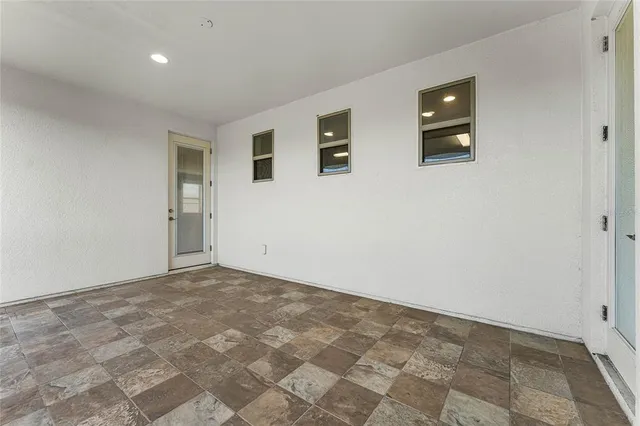 a view of an empty room with a window