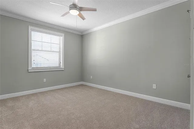 an aerial view of a house with a lake view