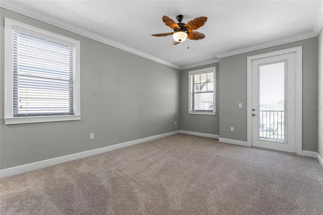 an aerial view of residential building with outdoor space and lake view
