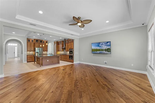 a kitchen with stainless steel appliances granite countertop a stove a sink and a refrigerator