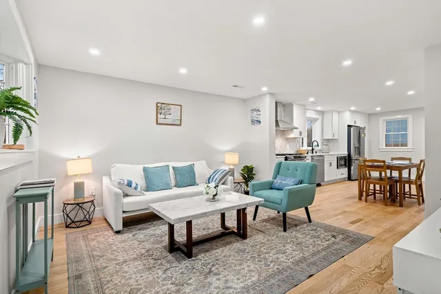 a living room with furniture and a table