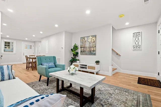 a living room with furniture and a table