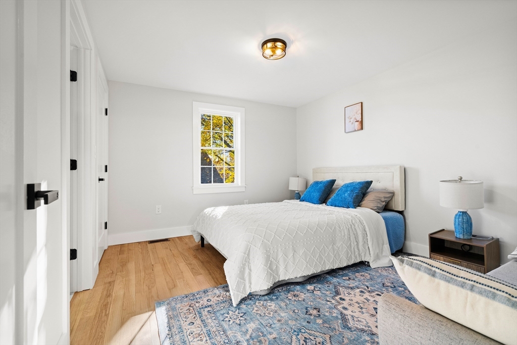 35 Dewey Street, Unit 35 Boston, MA 02125 - Photo 14 of 30 a bedroom with a bed and a window