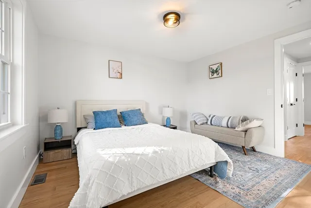 a bedroom with bed and a couch