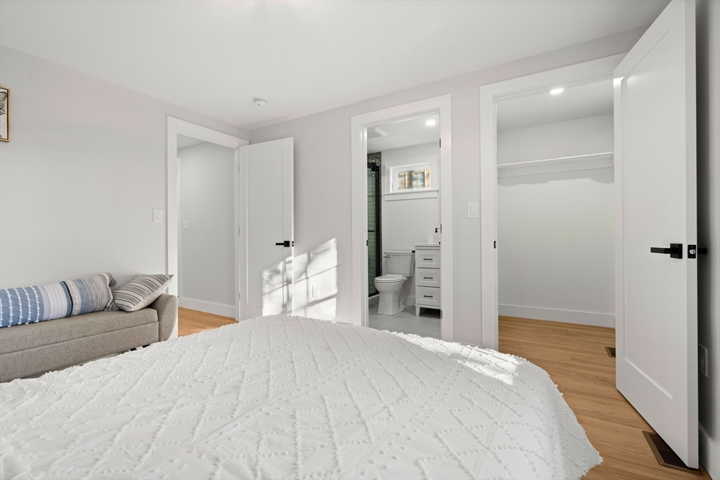 35 Dewey Street, Unit 35 Boston, MA 02125 - Photo 16 of 30 a bedroom with a bed and a couch