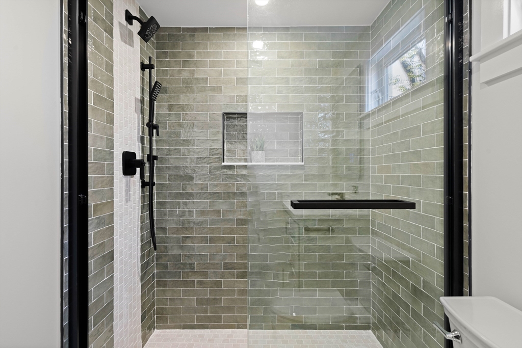 35 Dewey Street, Unit 35 Boston, MA 02125 - Photo 18 of 30 a bathroom with a shower