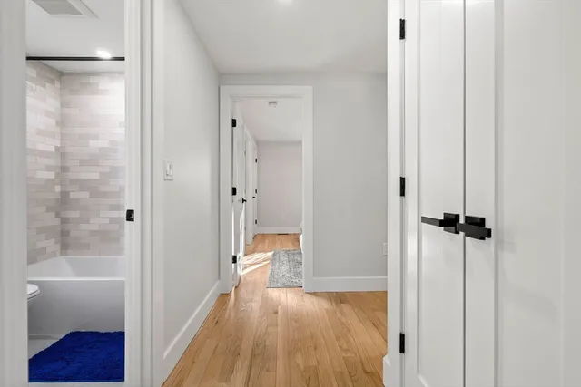 a view of a bathroom with a tub and shower