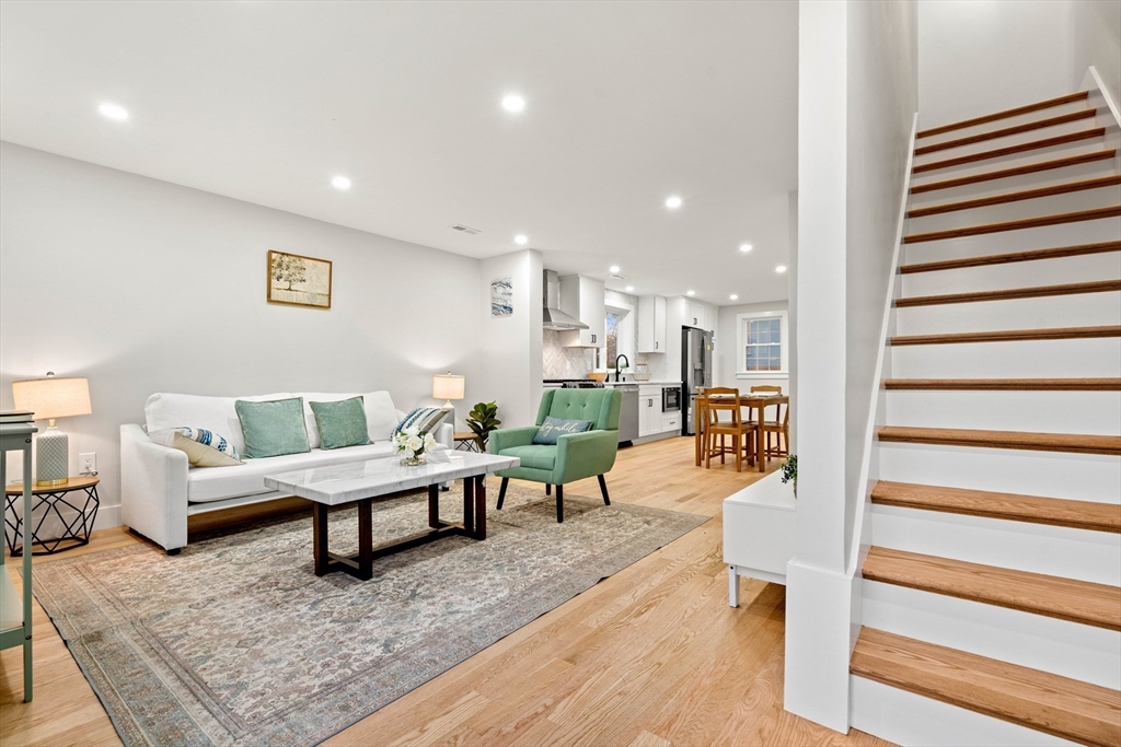 35 Dewey Street, Unit 35 Boston, MA 02125 - Photo 10 of 30 a living room with furniture and a rug