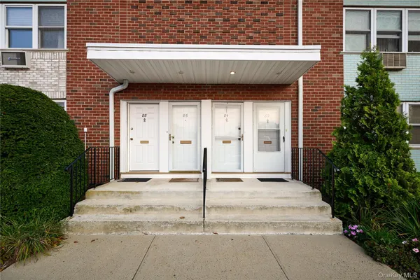a view of a house with a door and a outdoor space