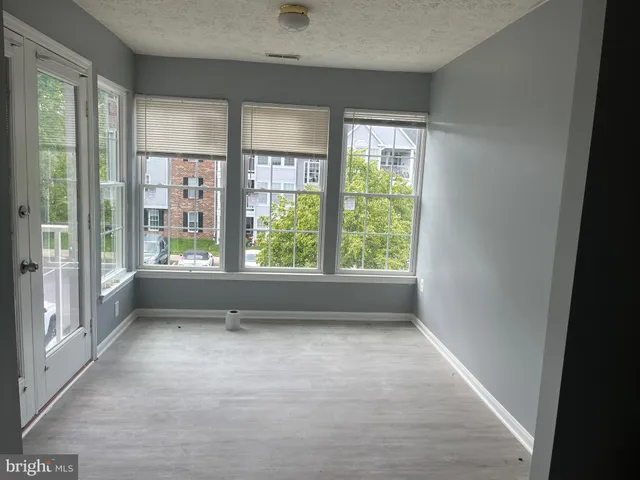 a view of room with window and furniture