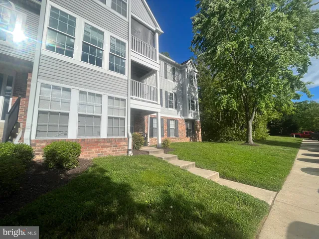 a view of an apartment with a garden