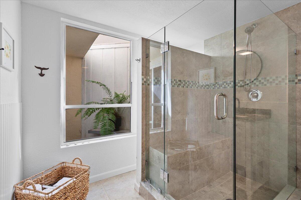 1605 Highway 1, Unit 7C Jupiter, FL 33477 - Photo 20 of 31 a bathroom with a shower and a sink