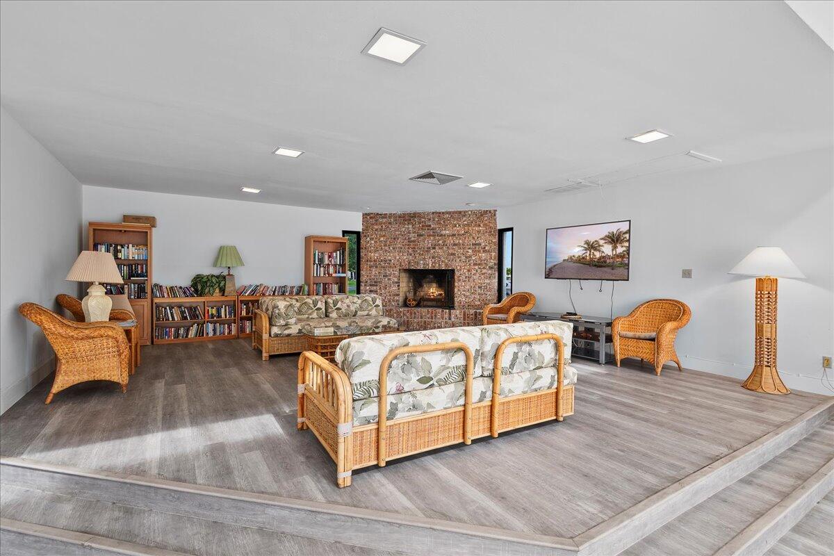 1605 Highway 1, Unit 7C Jupiter, FL 33477 - Photo 23 of 31 a living room with furniture and a fireplace