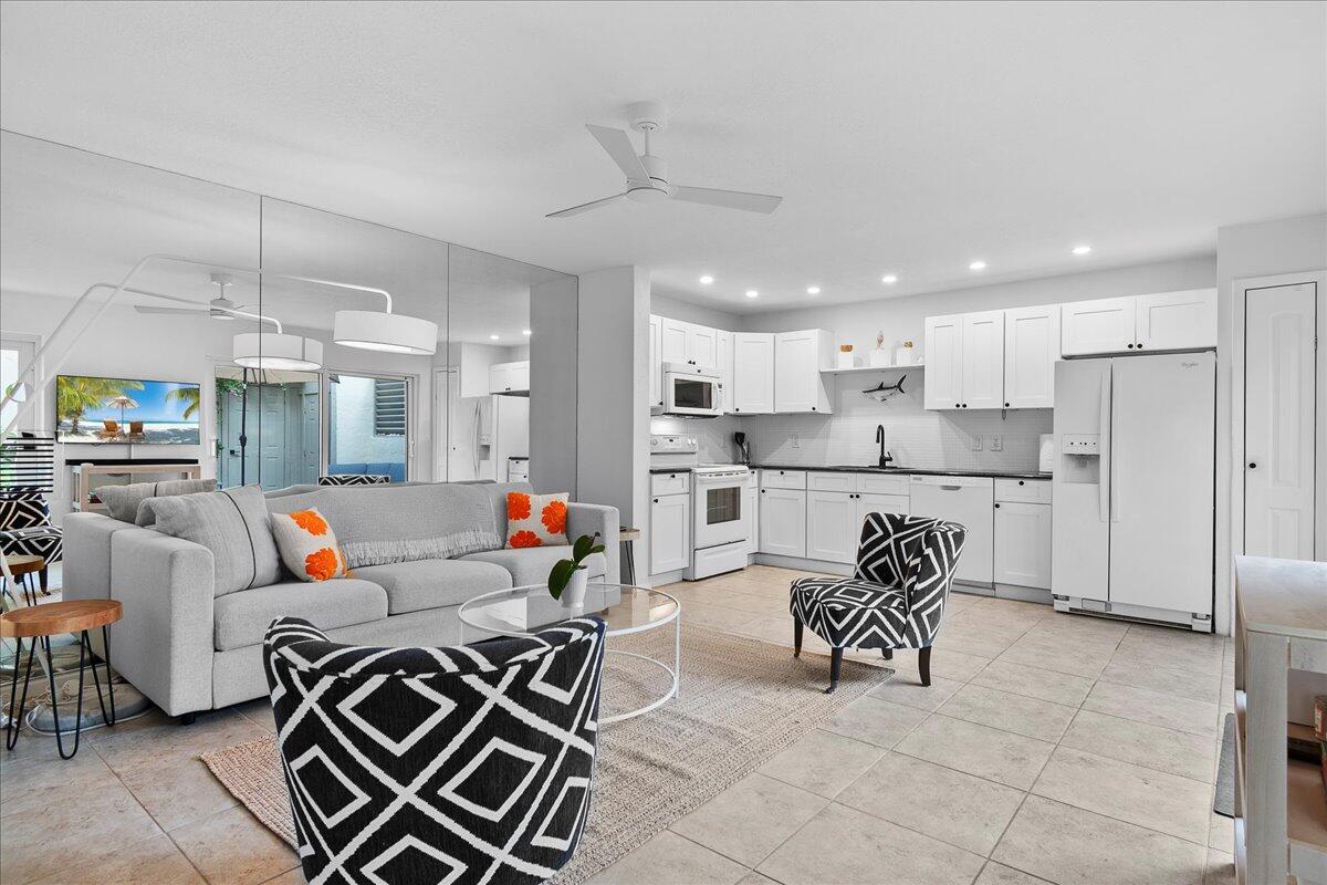 1605 Highway 1, Unit 7C Jupiter, FL 33477 - Photo 10 of 31 a living room with furniture and kitchen view